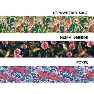May include: Three horizontal rows of repeating patterns featuring different animals. The top row features a yellow background with red strawberries and mice. The middle row features a dark green background with pink flowers and hummingbirds. The bottom row features a pink background with blue flowers and foxes.