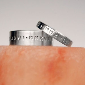 roman numeral eternity rings in silver