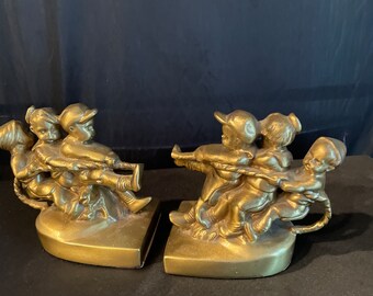 Childrens bookends set  Themed “playing tug of war“ , Gold cast Goebel collection by PM craftsman