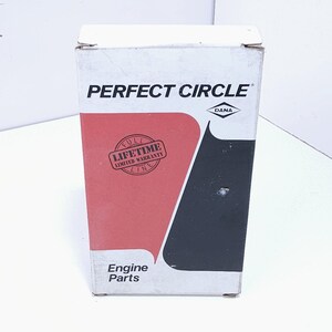 May include: A rectangular white cardboard box for Perfect Circle engine parts. The front features the brand name in black text, a Dana logo, and a red graphic shape with a circular stamp that reads Full Lifetime Limited Warranty Line.