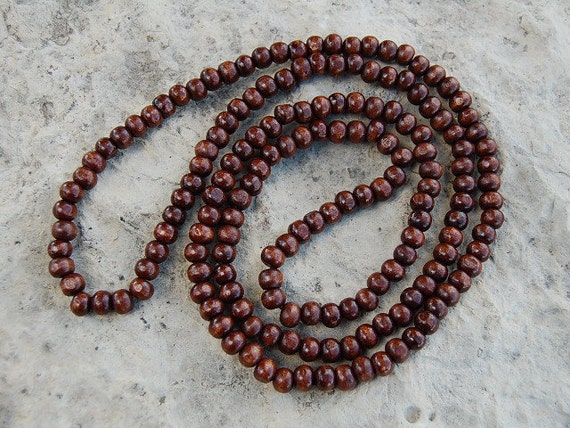 wooden bead necklaces | ... Detail: Balinese designer wear wooden bead  necklace in tropical colors | Wooden bead necklaces, Beaded necklace, Beaded  jewelry diy