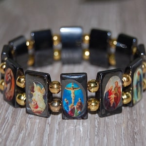 Bracciale Religioso Cattolico Con Perline In Legno Nero E Icone Sante - Tonalità Argento