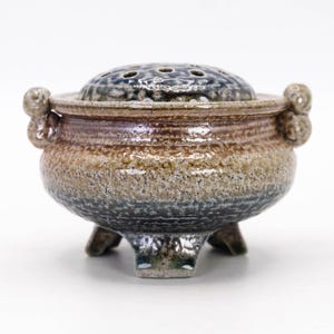 Back view of Mashiko pottery incense burner showing natural glaze variation and handmade wabi sabi character