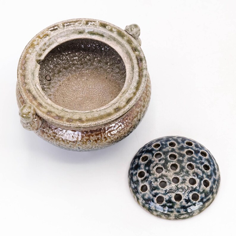 Top view of Mashiko yaki koro, open mouth incense burner with textured salt glaze surface
