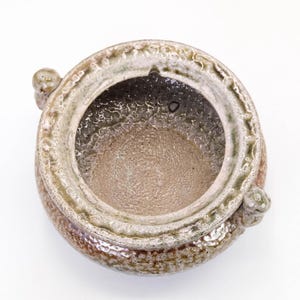Top view of Mashiko yaki koro, open mouth incense burner with textured salt glaze surface