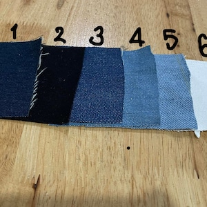 May include: Six fabric swatches in different shades of blue, black, and white. The swatches are labeled with numbers 1 through 6.