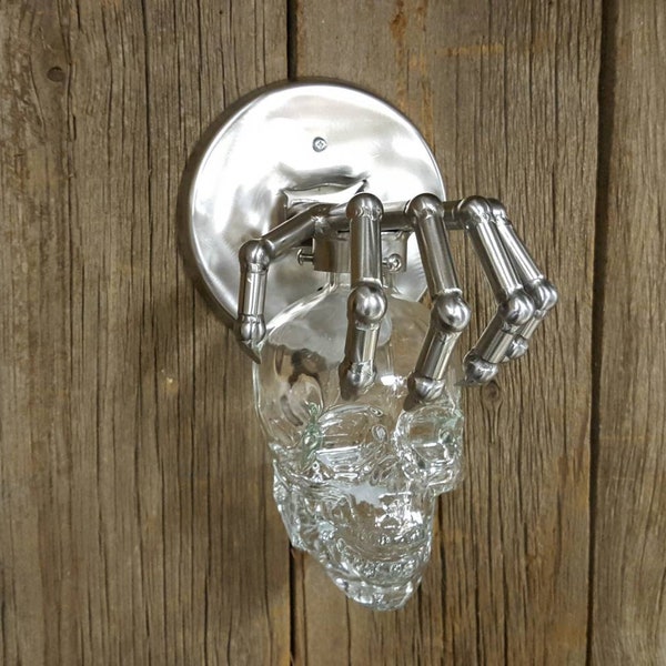 Stainless skull sconce.