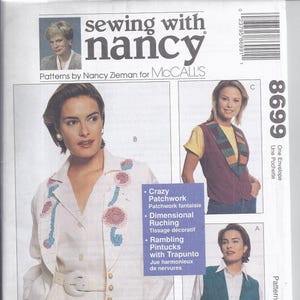 Puede incluir: Un patrón de costura de McCall's con diseños de Nancy Zieman. La imagen muestra a mujeres con varias prendas, incluyendo un traje blanco con bordados florales y chalecos. El número de patrón es 8699.
