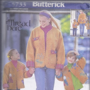 May include: Image of a Butterick sewing pattern featuring a woman and two children wearing matching mustard-colored jackets with embroidered details and plaid accents. The jackets are paired with blue jeans.