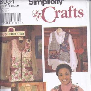 May include: Simplicity Crafts sewing pattern 8034. The pattern features vests with floral, plaid, and patchwork designs. The image shows several examples of the finished vests, including a floral vest, a plaid vest, and a patchwork vest. The pattern includes sizes XS, S, and M.