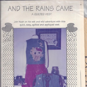May include: A package for a quilted vest pattern titled "And The Rains Came." The vest features a house and lightning bolt design. The package includes the text "Join Noah on his wet and wild adventure with this quick, easy, quilted and appliqued vest."