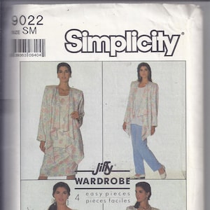 May include: Simplicity sewing pattern 9022, size SM. The pattern features a Jiffy Wardrobe with four easy pieces. The image shows a woman wearing a floral print outfit, including a jacket, top, and skirt. The pattern is suitable for an overlock/serger machine.