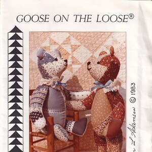 May include: A pattern cover for a 16-inch jointed teddy bear, featuring two fabric teddy bears. One bear sits on a wooden chair. The bears are made of patterned fabric with blue bows. The text "Goose on the Loose" is at the top.