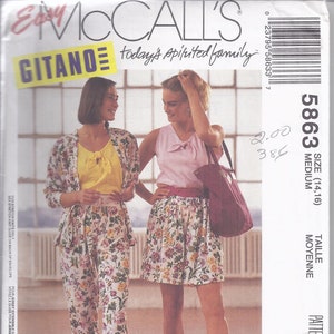 May include: McCall's sewing pattern envelope featuring two women modeling outfits. The outfits include a floral print skirt and pants, a yellow top, and a pink top. The text on the envelope reads "Easy McCall's GITANO today's spirited family".