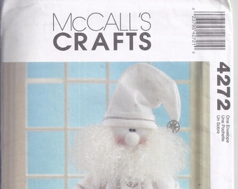 McCall's Crafts 4272 from 2003.   Silver and White, 20" tall  Santa and bag of toys. UNCUT