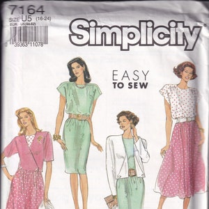 May include: Simplicity sewing pattern 7164, featuring illustrations of four different women's outfits. The outfits include dresses, skirts, and jackets. The words "EASY TO SEW" are printed on the pattern.