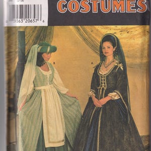 May include: A Simplicity Costumes sewing pattern envelope 7756 for sizes 4, 6, 8. The front displays two historical-style gowns: one in green and white stripes with a matching headpiece, and one in dark blue with gold trim and a veil.