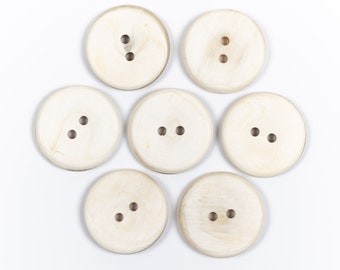 Horn buttons / size 11-50 mm. / 2 holes / Small buttons 11 mm. Large buttons 50 mm. / White buttons / Natural buffalo horn button