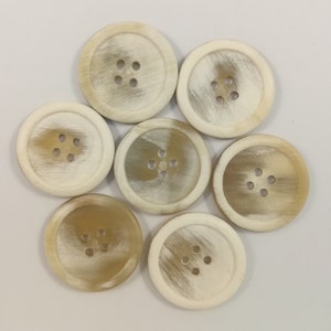 Horn buttons with rim/10-28 mm./ 4 holes