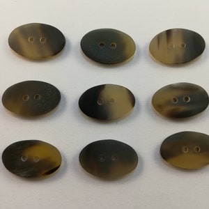 Real Horn buttons / Size 25mmx15mm. 2 Holes, Oval Shape, Brown