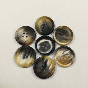 Horn buttons with rim/10-28 mm./ 4 holes