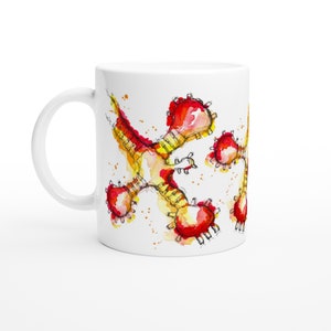 May include: White ceramic mug with a watercolor illustration of a red and yellow abstract design. The design features a series of interconnected shapes that resemble a stylized flower or star.