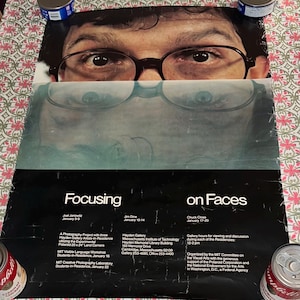 May include: A vintage poster titled "Focusing on Faces" features a close-up of a person's face wearing glasses. The poster includes text about a photography project, gallery hours, and the MIT Committee on the Visual Arts.
