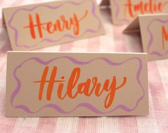 Modern Name Cards - Brush Written Look - Wave Border Design - Orange and Purple Wedding Event Place Cards - Hand Lettered