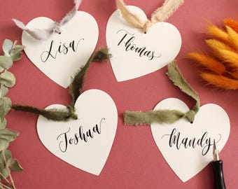 Heart Shaped Name Tags - Calligraphy Place Cards - Black Ink - Personalised Names  - White Card With Ribbons Green Grey Neutral