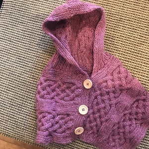 Hand knitted cable cape