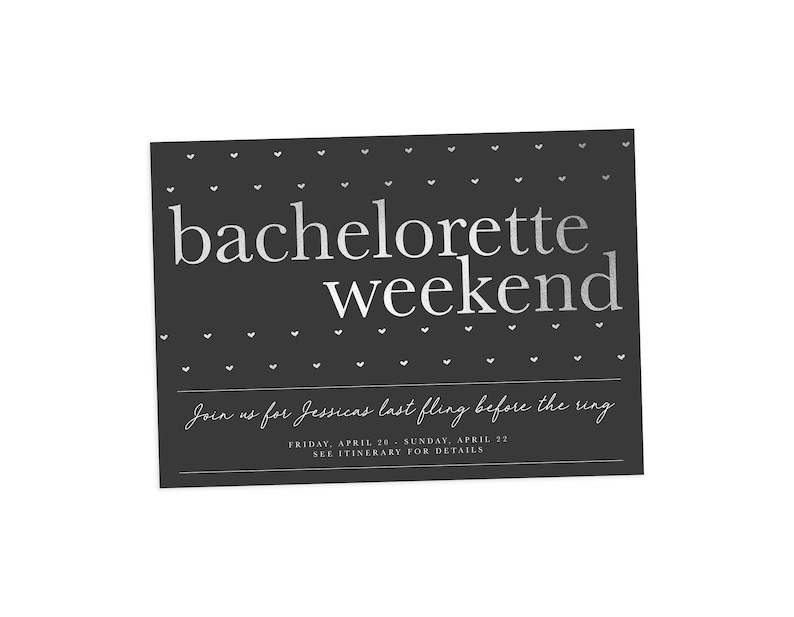 May include: A dark gray invitation card with the words "bachelorette weekend" in a silver font. The card has small white heart shapes and additional text inviting guests to a bachelorette party.