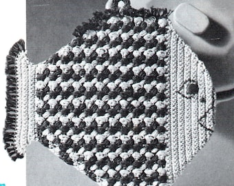 May include: Black and white crocheted teapot cozy with a fringe border. The cozy is shaped like a teapot with a handle and spout.