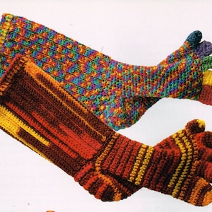 May include: Two pairs of colorful crocheted socks. One pair is multi-colored with a rainbow pattern. The other pair is red, orange, and yellow with a striped pattern.