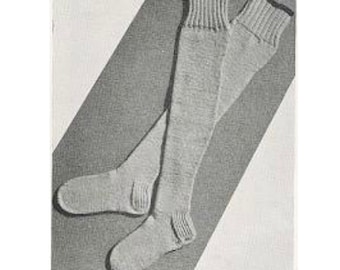 May include: A pair of light gray knee-high socks. The socks have ribbed cuffs with a dark trim and are made of a soft, knitted material. The socks are designed to be worn on the legs and feet.