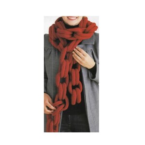 May include: A chunky, chain-link style scarf in a vibrant red color. The scarf is made of a thick, knitted material and is draped around the neck and shoulders. The scarf's unique design adds a bold statement to any outfit.