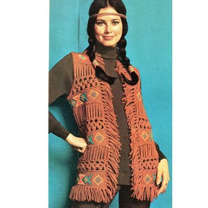May include: A crocheted vest with fringe and geometric patterns in shades of orange, brown, and turquoise.