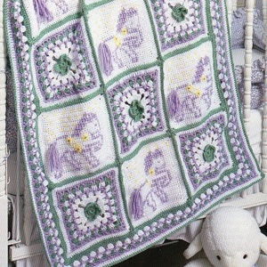 May include: A crocheted baby blanket with a purple, green, and white color scheme. The blanket is made up of squares with different designs, including flowers and a baby carriage.