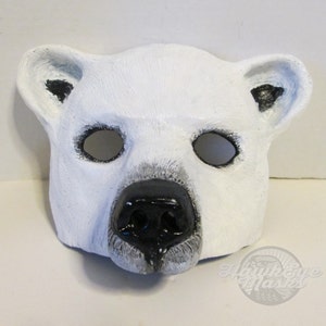 Puede incluir: M&aacute;scara de oso polar blanco con ojos y nariz negros. La m&aacute;scara est&aacute; hecha de un material suave y flexible, ideal para fiestas de disfraces o Halloween.