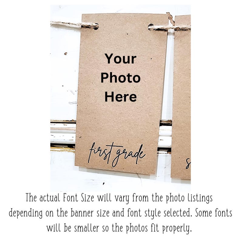 May include: A brown card with the text "Your Photo Here" and "first grade" written in cursive. The card is attached to a string.