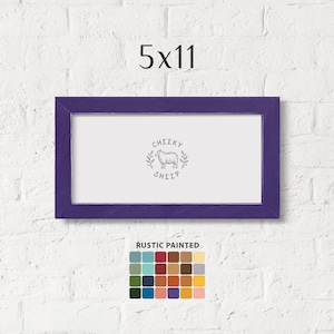 May include: A purple 5x11 inch rustic painted frame with a white mat and a black and white illustration of a sheep with the text "Cheeky Sheep". The frame is shown against a white brick wall. A color palette of 25 colors is shown below the frame.