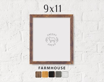 May include: A 9x11 inch farmhouse style picture frame with a brown wood finish. The frame has a white mat and a white background with a black and white illustration of a sheep with the text "Cheeky Sheep". The frame is shown against a white brick wall. The frame is available in five different wood finishes.