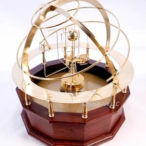 Grand Orrery in beautiful semi-precious stone, hardwoods, brass. Correct relational motion of 9 planets. True brass geared clockwork.