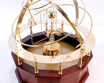 Grand Orrery in beautiful semi-precious stone, hardwoods, brass. Correct relational motion of 9 planets. True brass geared clockwork.