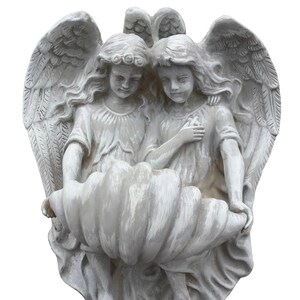 May include: Two white cherub angels with wings, holding a large, white, seashell-shaped object. The angels are sculpted in a realistic style and have delicate features.