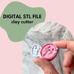 May include: Pink clay cutter with a lobster design held by a hand. The cutter is round with a detailed lobster silhouette. The image also shows two other cutters with lobster designs. Text on the image reads "DIGITAL STL FILE clay cutter".