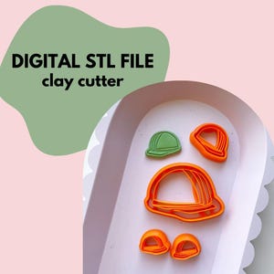 May include: A collection of orange and green clay cutters in the shape of construction hats. The image includes the text "DIGITAL STL FILE clay cutter" in black letters on a green background, set against a pink backdrop.