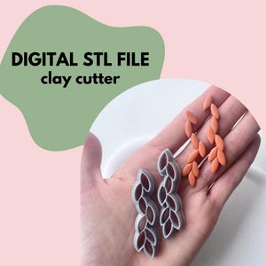 May include: The image shows two leaf-shaped clay cutters and two sets of orange clay earrings. The text "DIGITAL STL FILE clay cutter" is in the upper left corner. The background is a light pink and green.