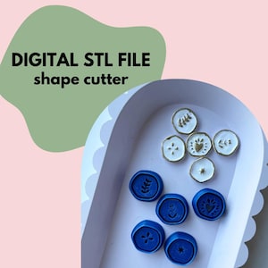 May include: A white tray containing blue and white ceramic shape cutters. The cutters are shaped like leaves, hearts, and stars. The text "DIGITAL STL FILE shape cutter" is written on a green background.