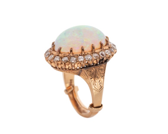 Circa 1920s 15 Carat Opal Ring With Diamonds Crafted in 14 Karat