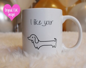 May include: White ceramic mug with a black outline of a dachshund and the text "I like your" printed on the front.